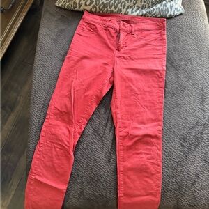 J Brand skinny jeans in burnt brick red color.